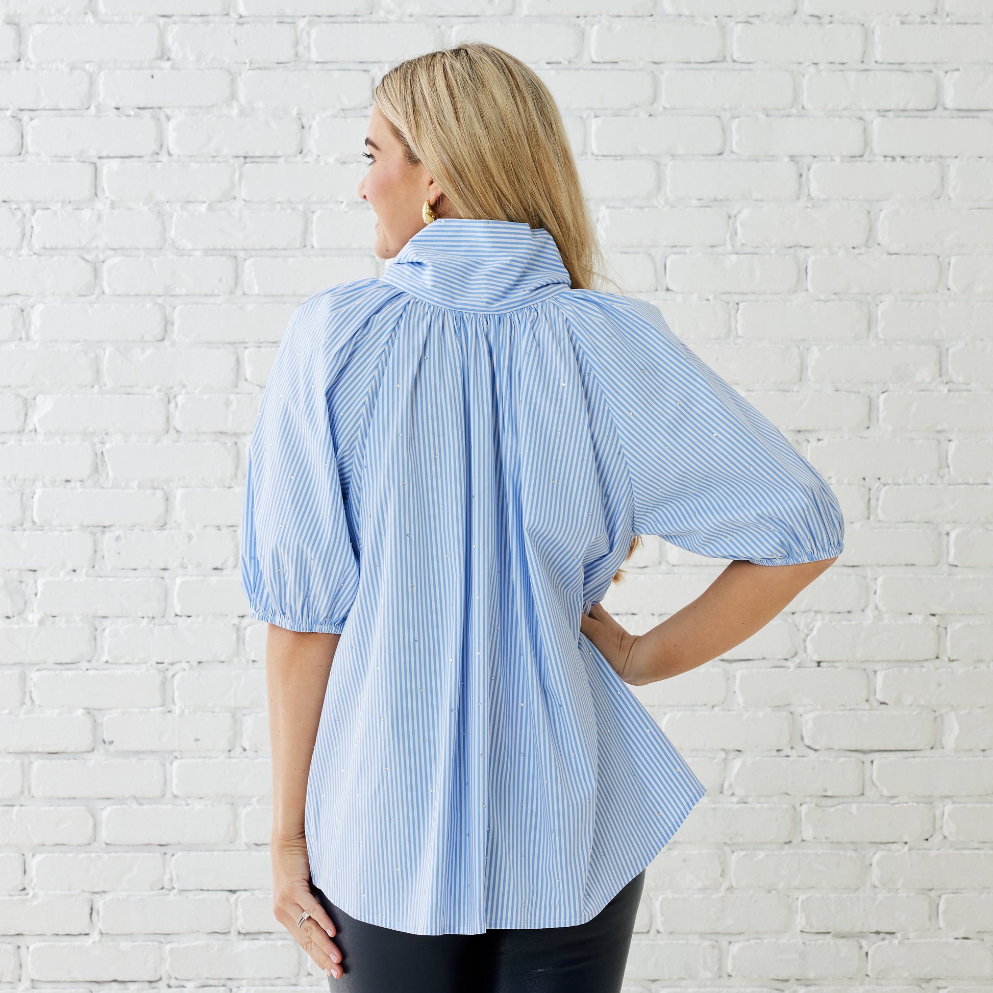 Caryn Lawn Ryan Bow Top in blue and white stripe with puff sleeves, back view